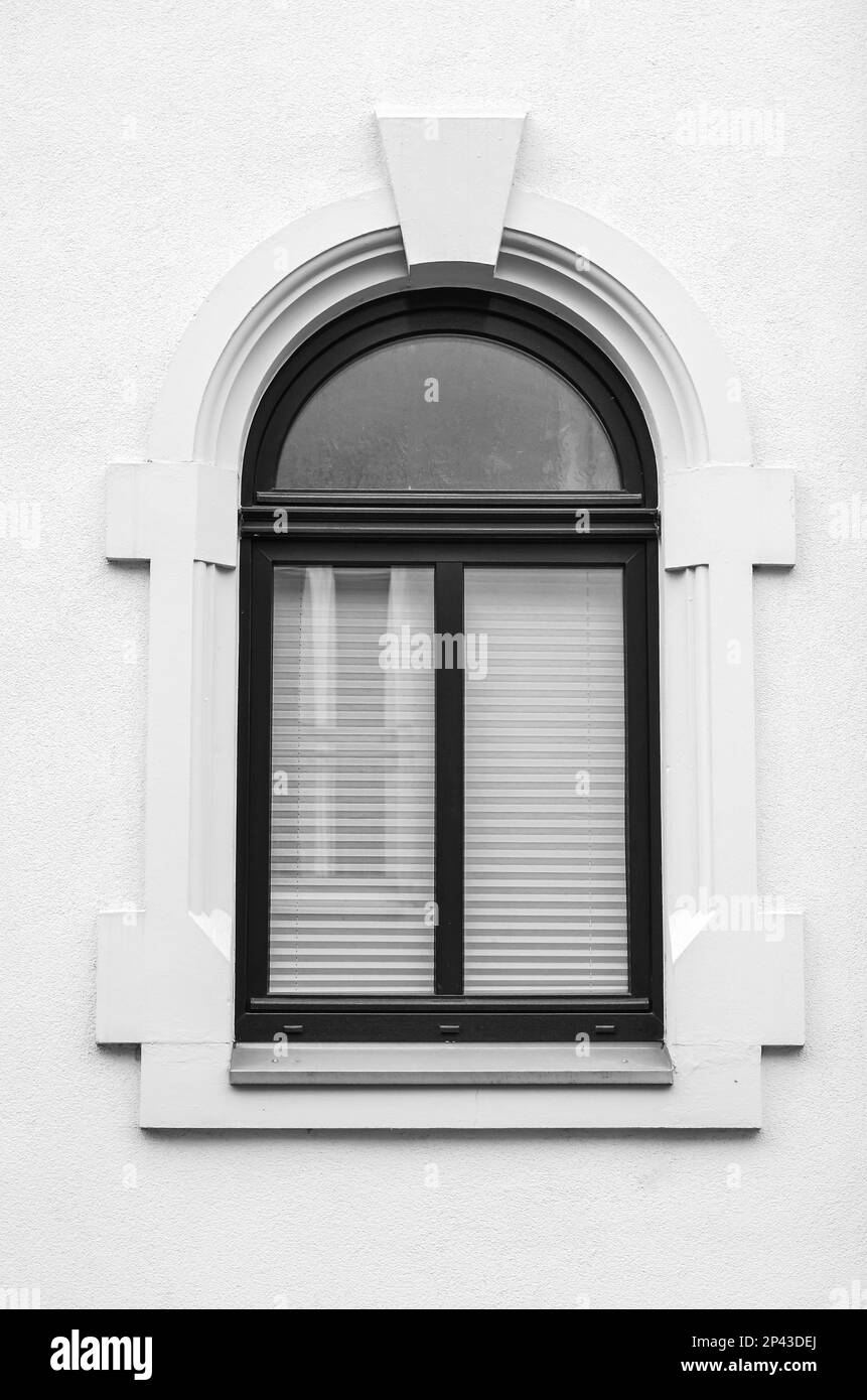 View of white building with black window Stock Photo Alamy