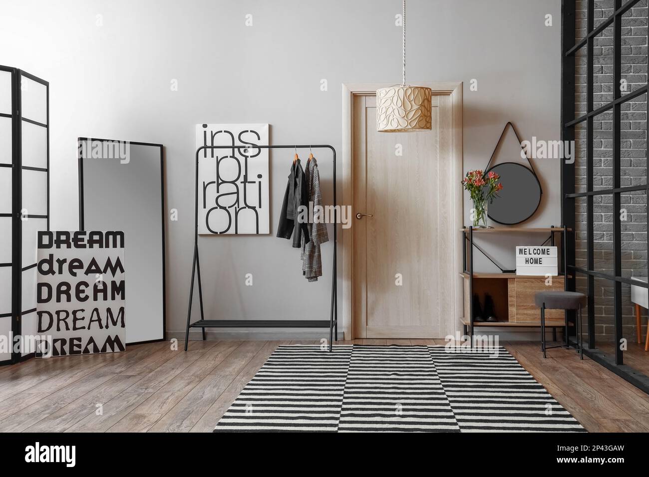 Interior of modern hall with rack, mirrors and door Stock Photo - Alamy