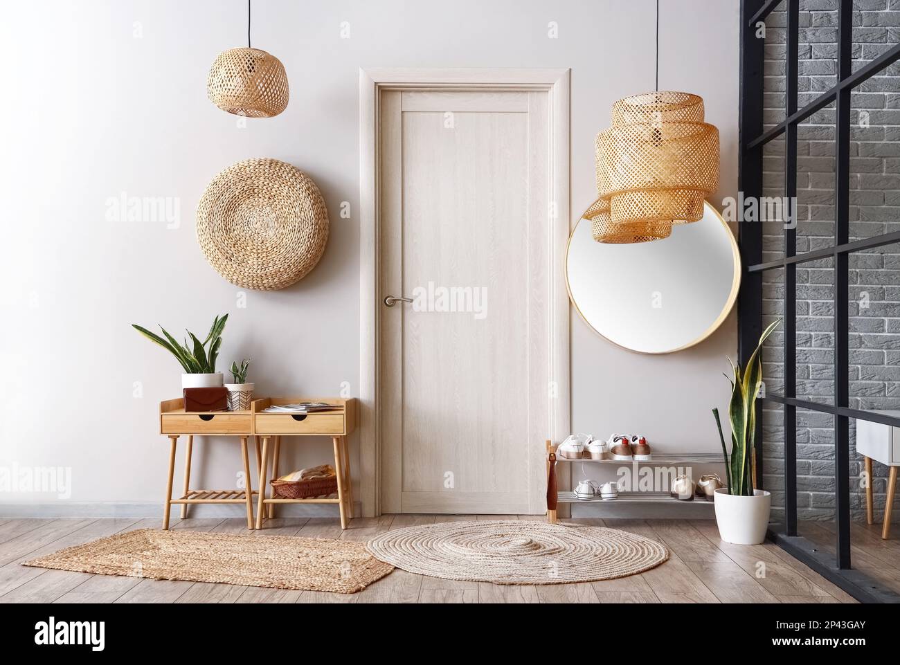 Interior of light hall with tables, shoe stand and door Stock Photo - Alamy