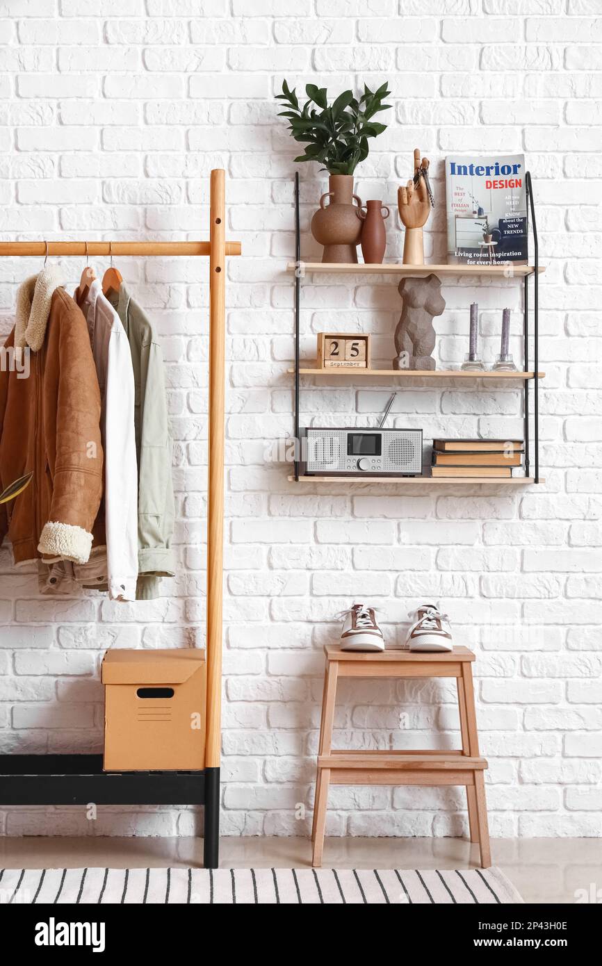 Interior of stylish hall with rack and shelf Stock Photo Alamy