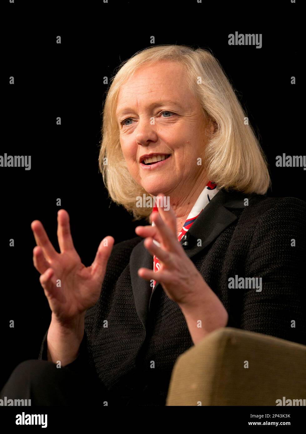 HewlettPackard CEO Meg Whitman gestures as she speaks with members of
