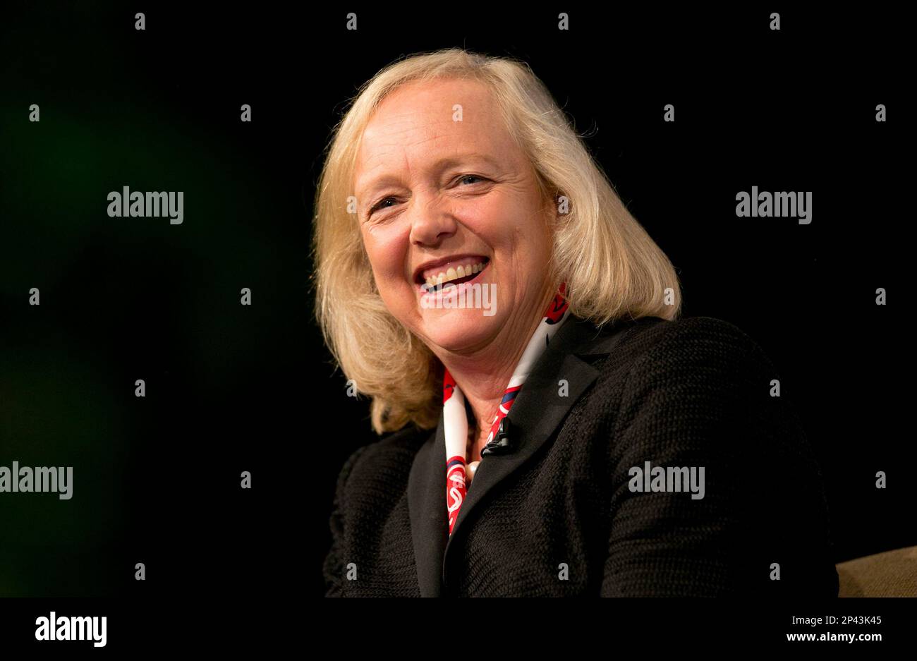 HewlettPackard CEO Meg Whitman laughs as she speaks with members of