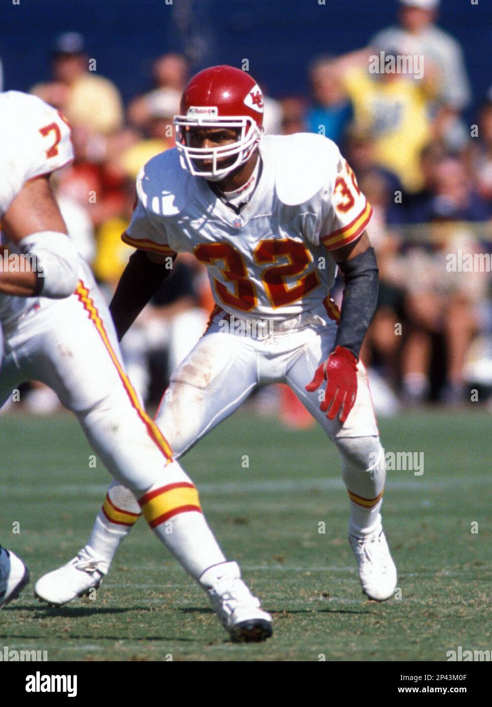 FILE - Kansas City Chiefs' running back Marcus Allen crosses the goal line  for a third quarter touchdown as Los Angeles Raiders' Eddie Anderson tries  to stop him in Los Angeles, in