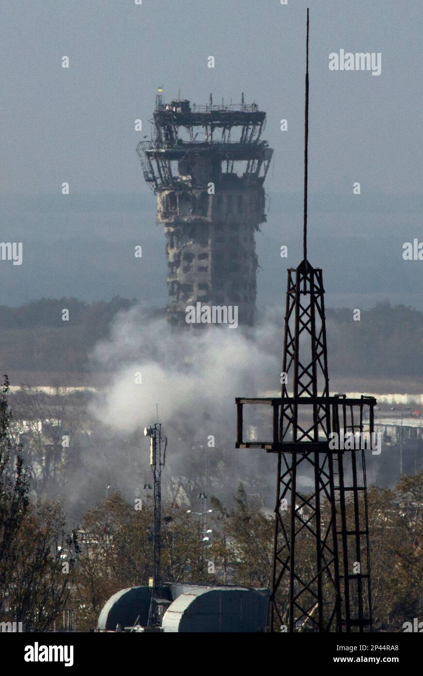 Smoke rises near the traffic control tower of Donetsk Sergey Prokofiev  International Airport during artillery battle between pro-Russian rebels  and Ukrainian government forces in the town of Donetsk, eastern Ukraine  Wednesday, Oct.