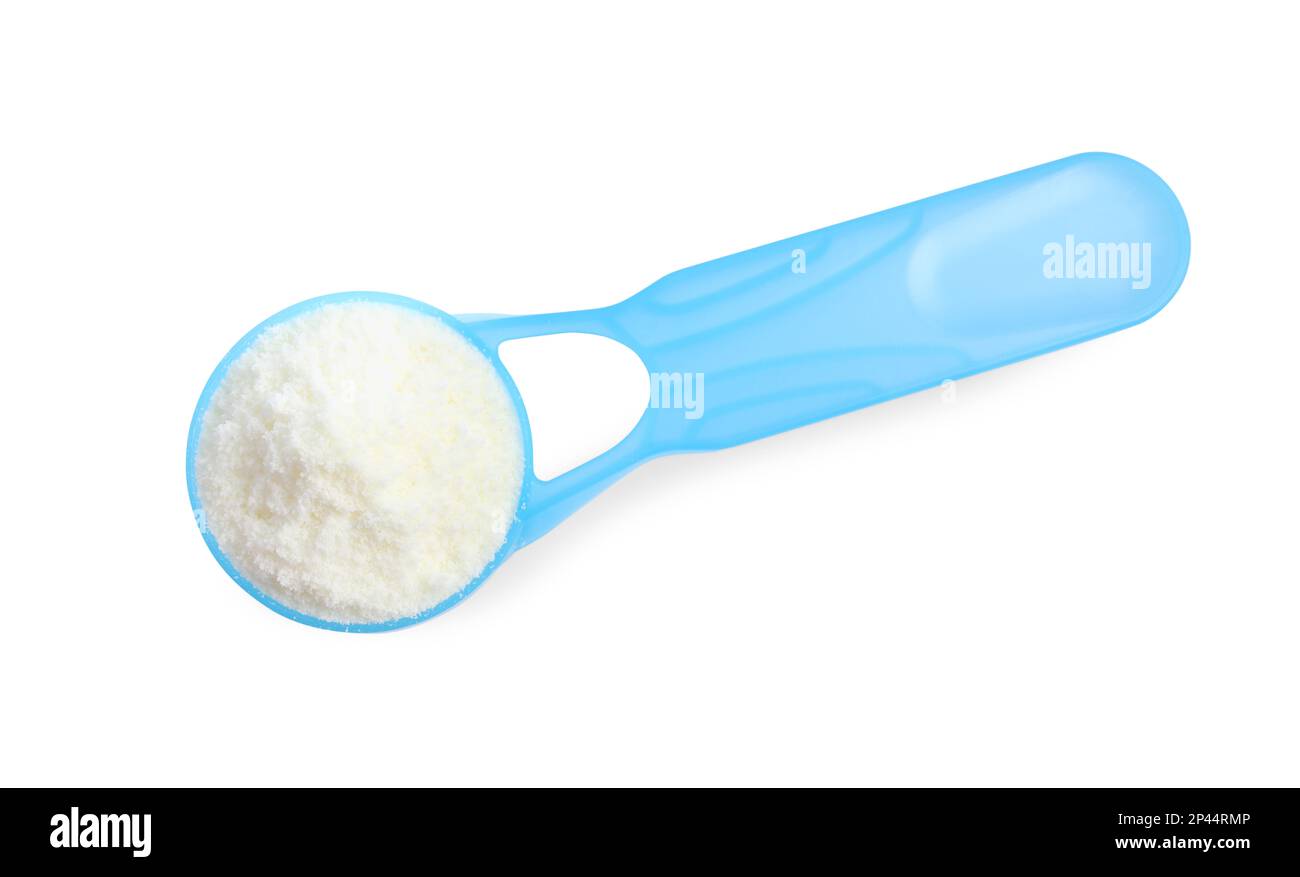 Scoop of powdered infant formula on white background, top view. Baby