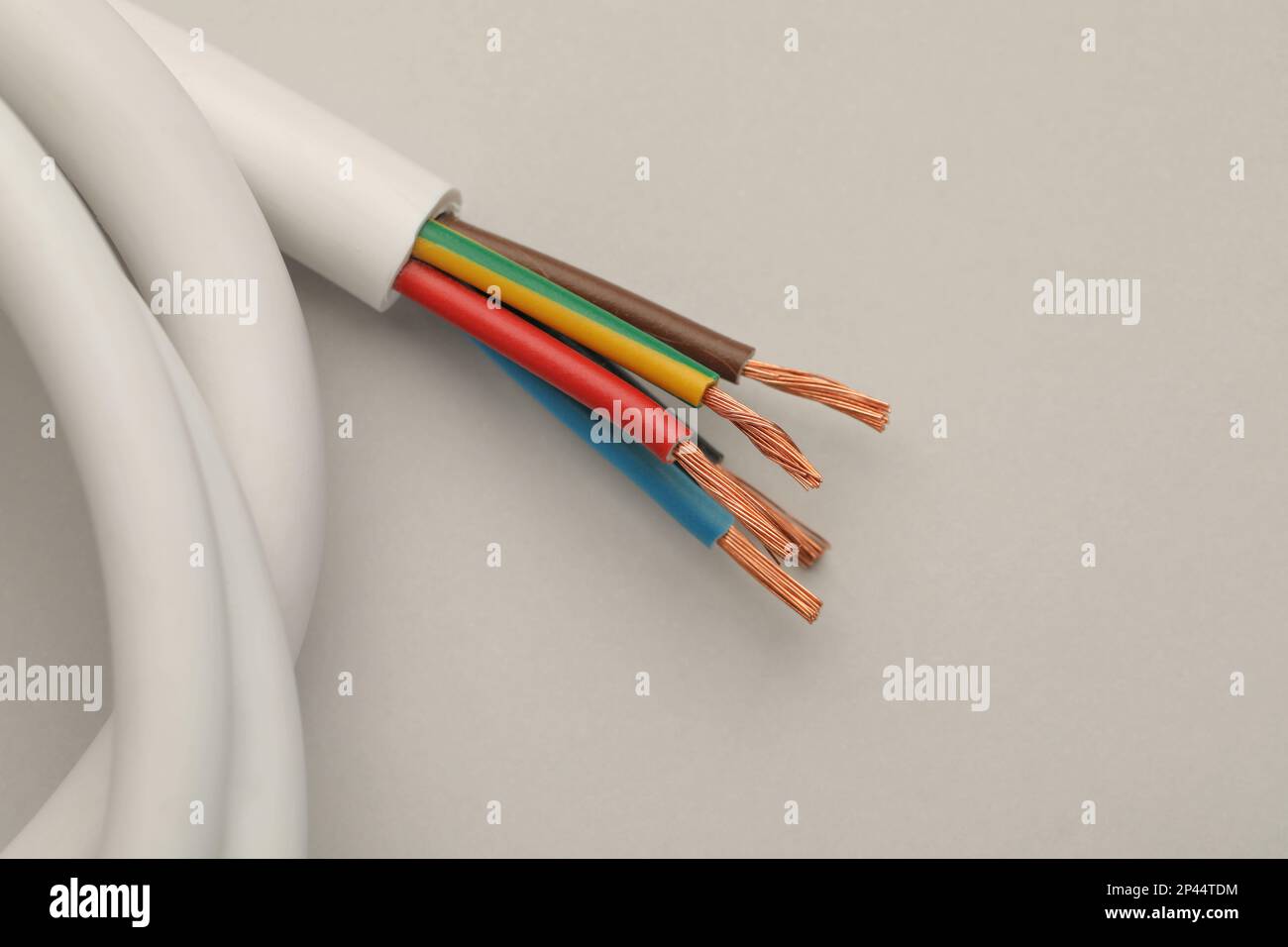 Electrical wires on light background, top view Stock Photo