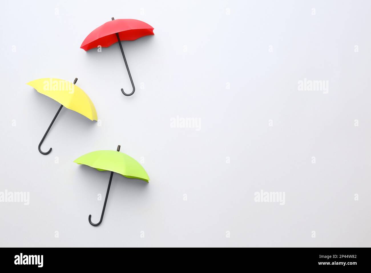 Different umbrellas on white background, top view. Space for text Stock Photo