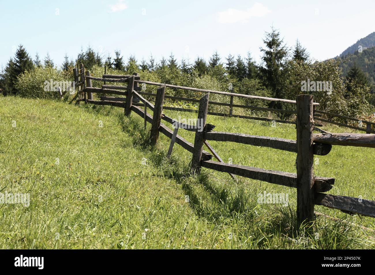 Beautiful view of mountain countryside with wooden fence Stock Photo ...
