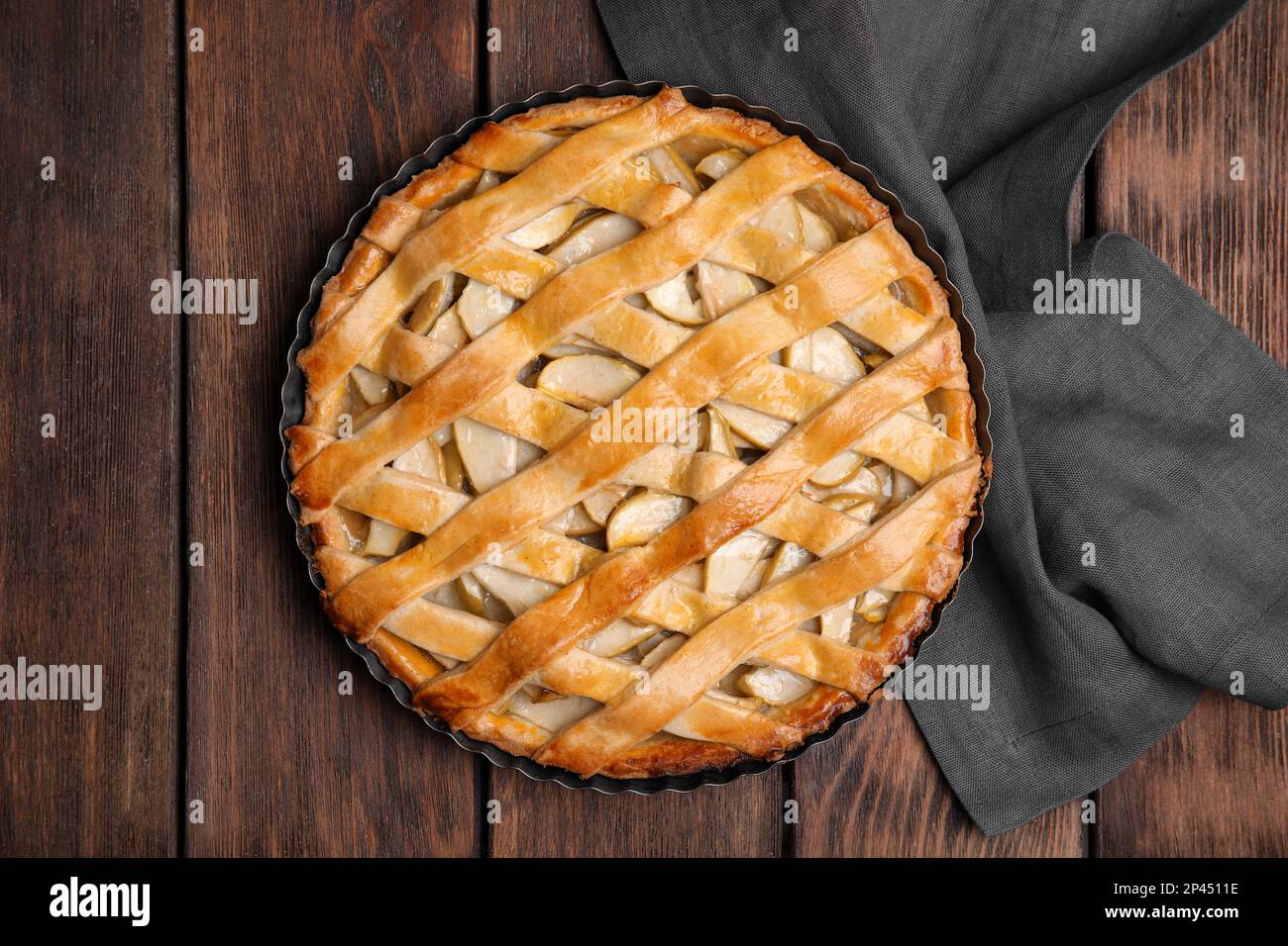 Delicious traditional apple pie on wooden table, top view Stock Photo