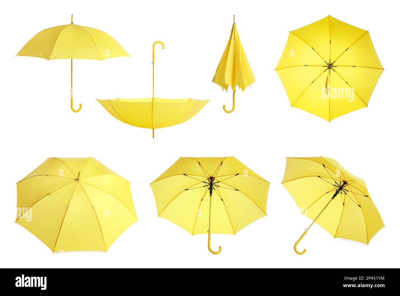 Set with stylish yellow umbrellas on white background Stock Photo
