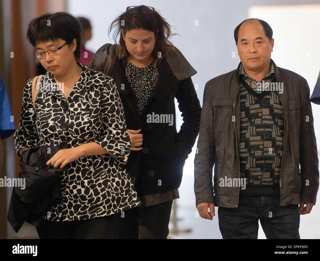 Diran Lin, right, father of Jun Lin, and his translator, Anna Liu, left ...