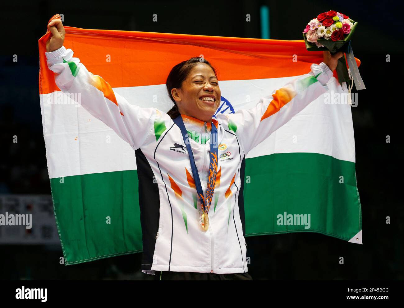 India s M C Mary Kom Holds The Indian National Flag And Celebrates Her india-s-m-c-mary-kom-holds-the-indian-national-flag-and-celebrates-her