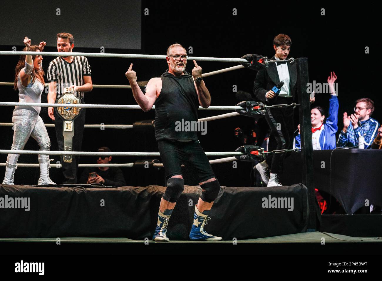 London, UK, 05th Mar 2023.Greg Davies challenges Rosie Jones to a fight and gives the middle finger to the rules. 'Max and Ivan's 'The Wrestling' ' sees well known comedians transform into wrestlers along real pros. Just For Laughs London, in its inaugural year, runs in venues at the O2 from Mar 2-5, 2023. Participating comedians and pros in the ring are: Rachel Parris, Jazz Emu, Flo & Joan, Nick Helm, Suzi Ruffell, Aisling Bea, Iain Stirling, Nish Kumar, Matthew Crosby, Olga Koch, Rosie Jones, Greg Davies, Rishi Ghosh, Mark Silcox, Ray Badran, Siblings, Nina Samuels, Sarah Keyworth, Rachel W Stock Photo