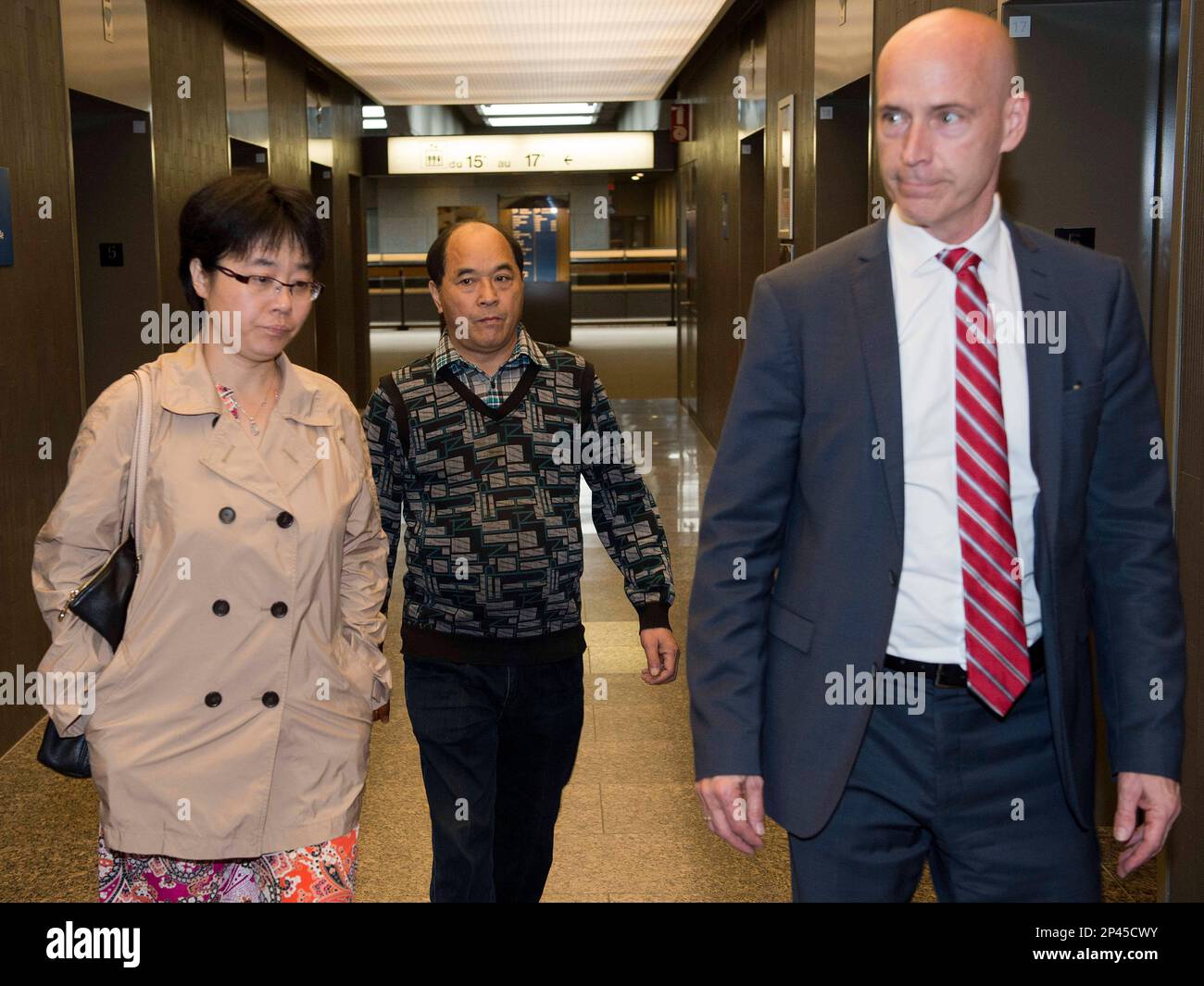 Diran Lin, center, father of Jun Lin, family lawyer Daniel Urbas, right ...