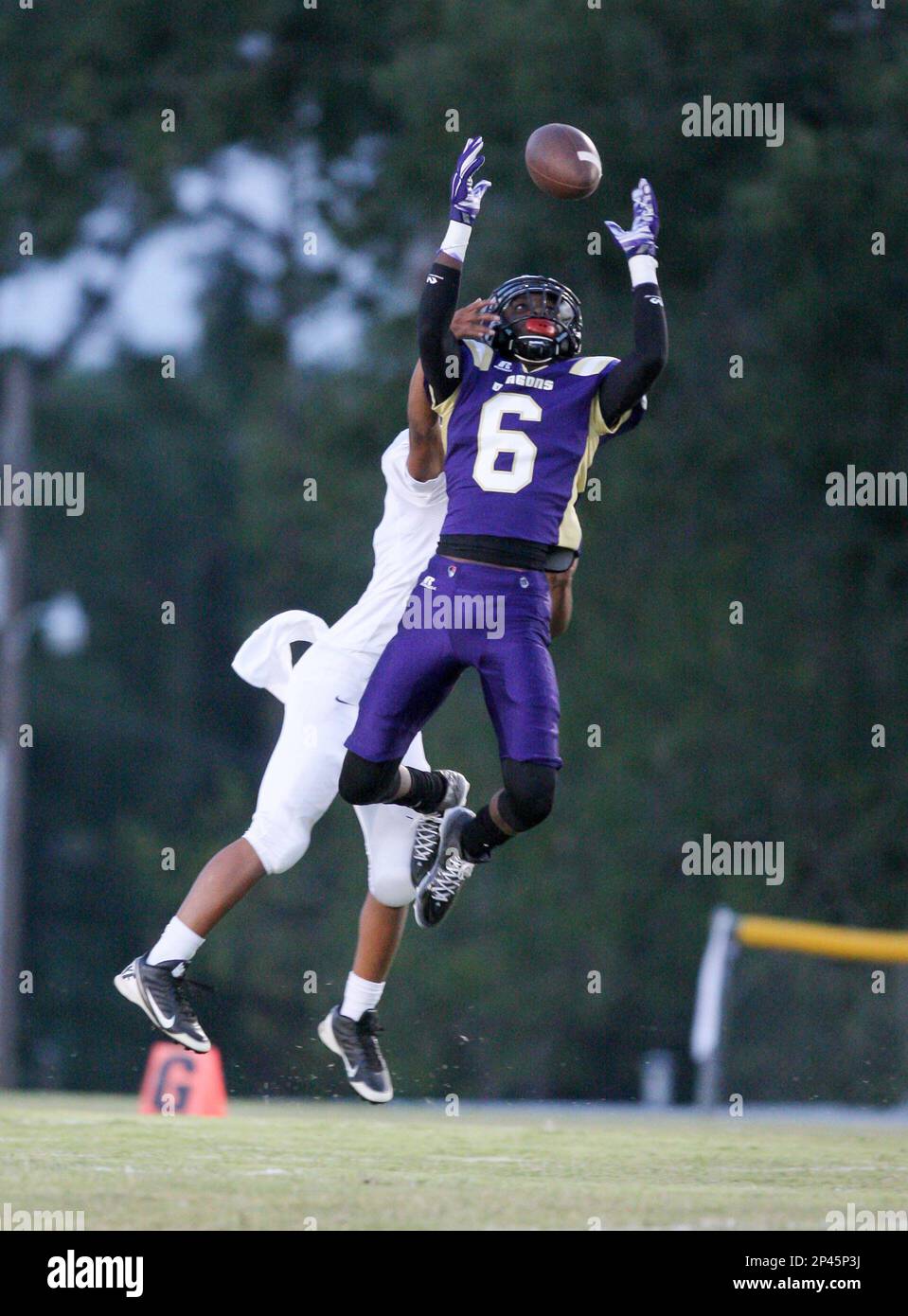 Junction City's Javontay Rogers (6) tries to get a handle on a