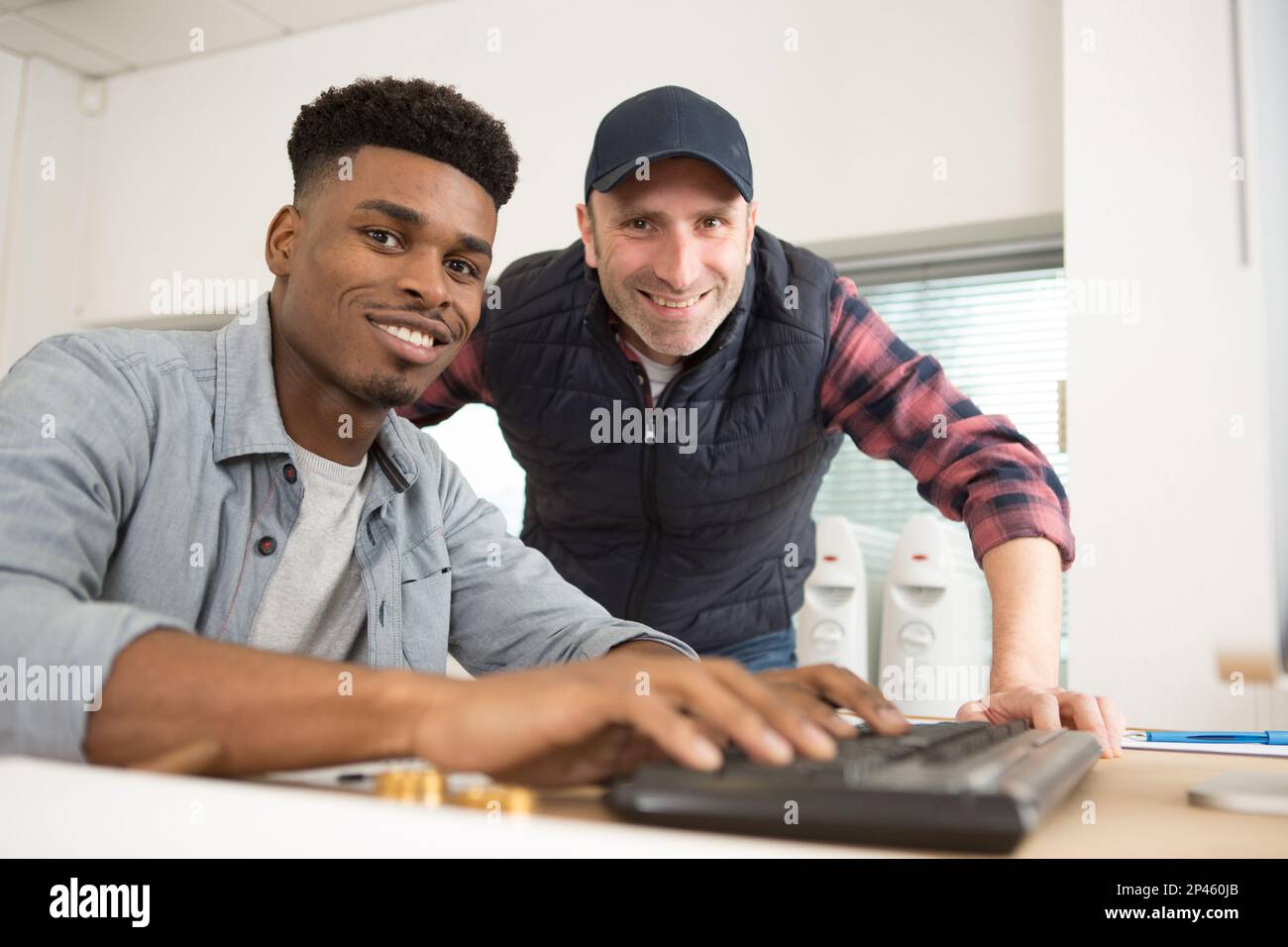 happy two designers working together Stock Photo - Alamy