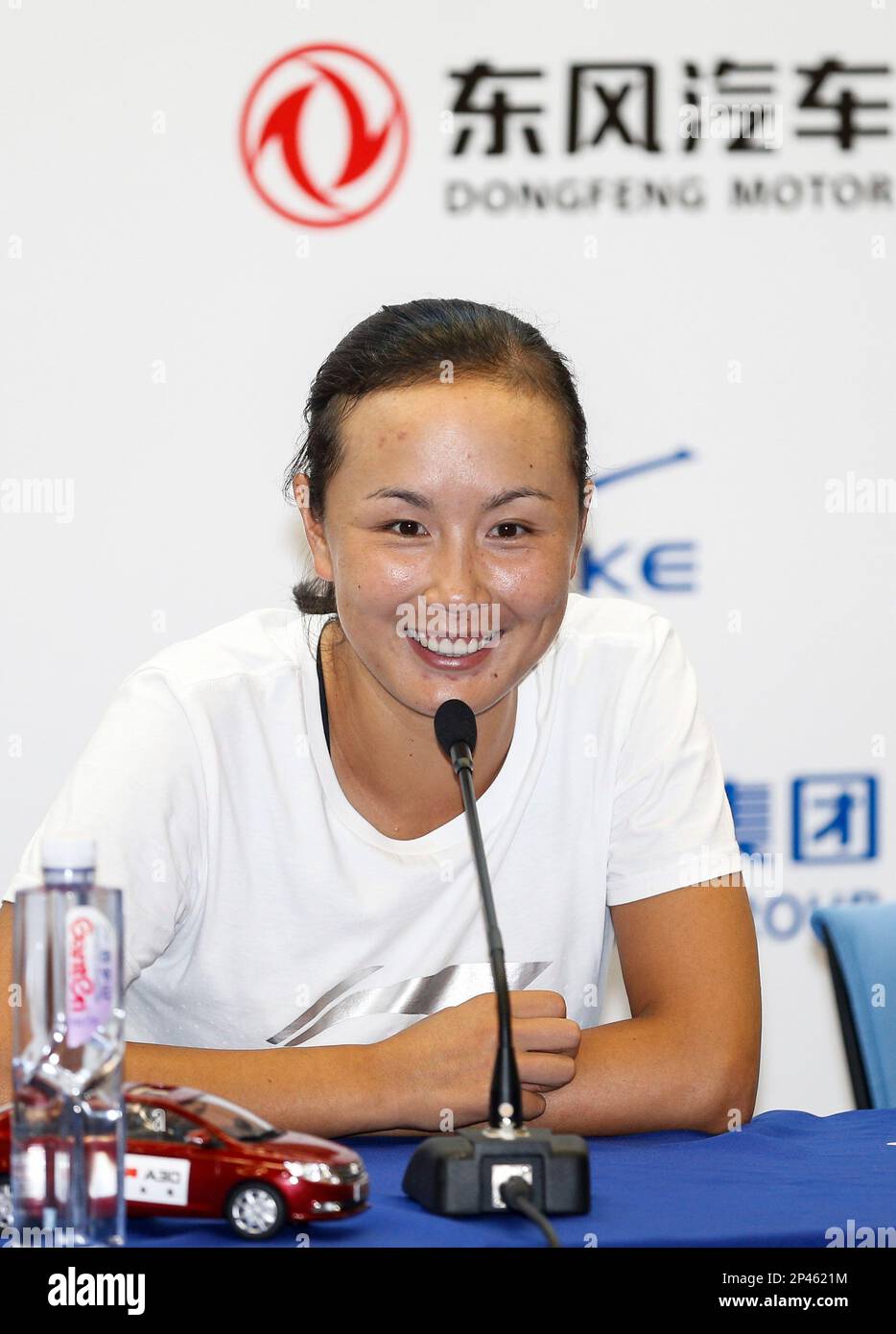 Peng Shuai of China smiles at a press conference after the women's