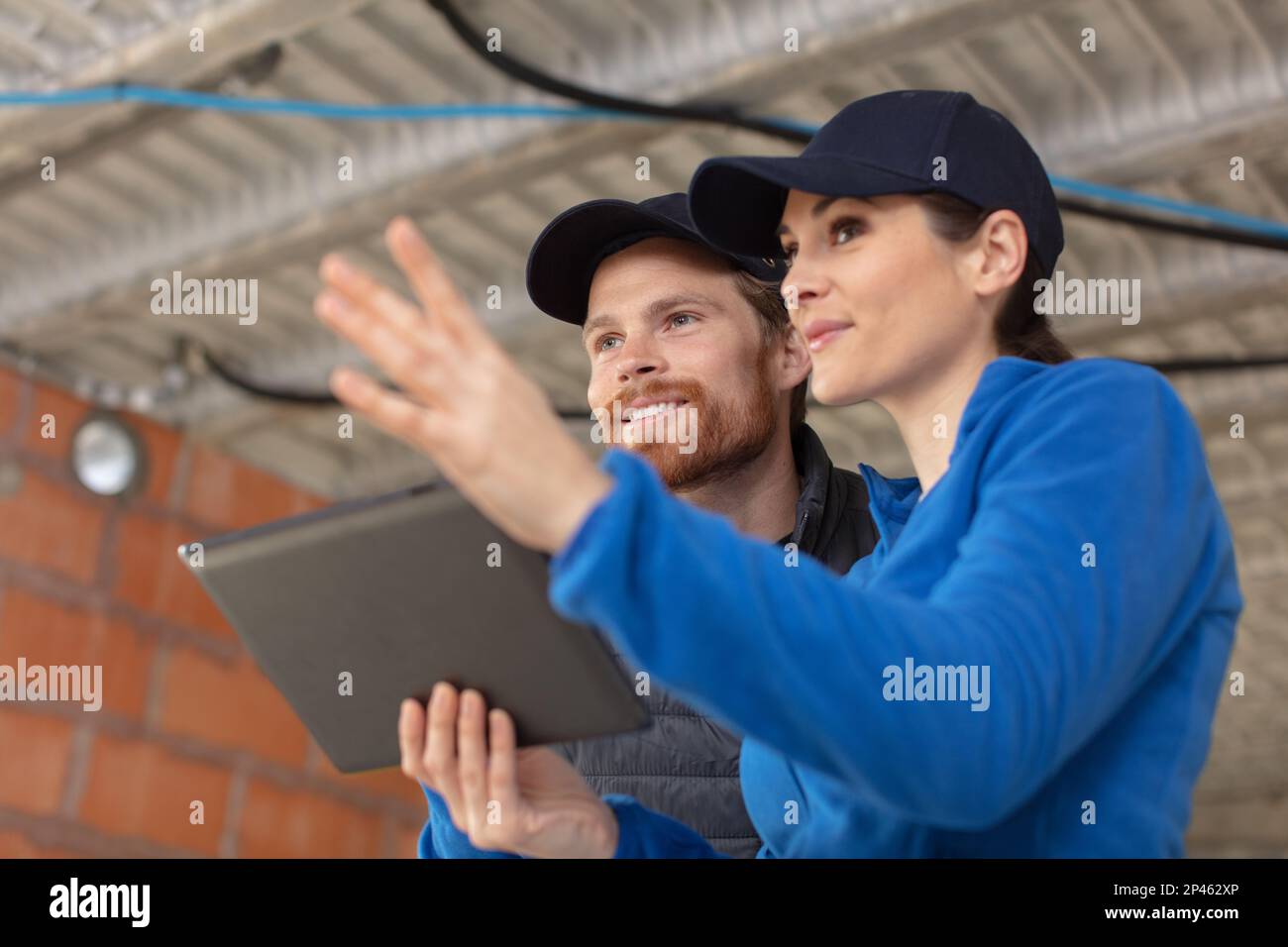 engineers reviewing construction site together Stock Photo