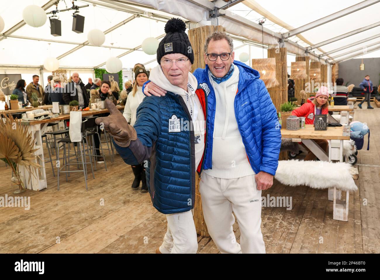 Heringsdorf, Germany. 05th Mar, 2023. Wolfgang Lippert (l) and Wolfram Becker celebrate at the final day of the 'Baltic Lights' - sled dog race on the island of Usedom. Credit: Gerald Matzka/dpa/Alamy Live News Stock Photo