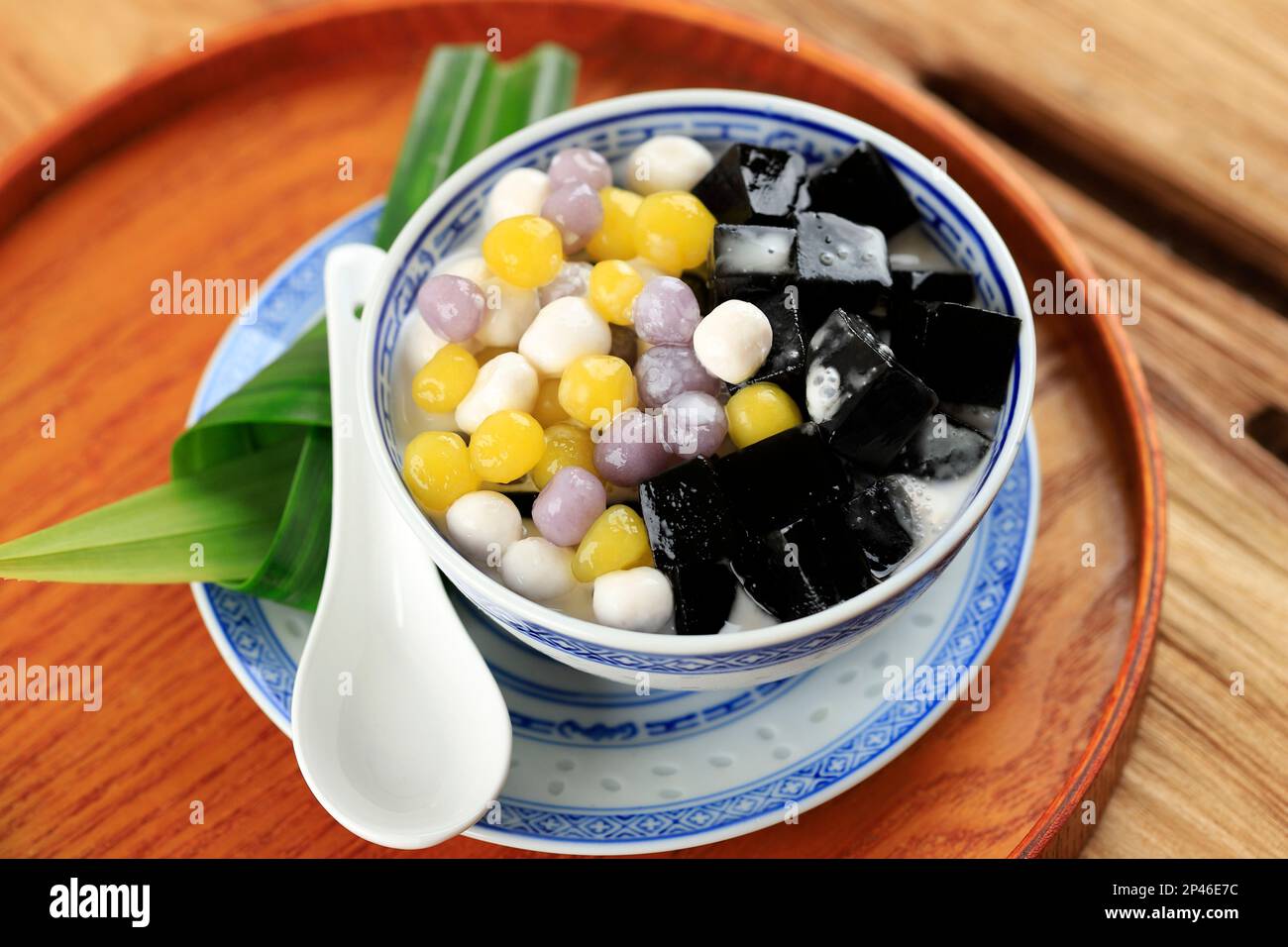 Chinese Dessert Black Grass Jelly with Taro Balls, Served with Sweet Coconut Milk. Cincau Hitam Stock Photo