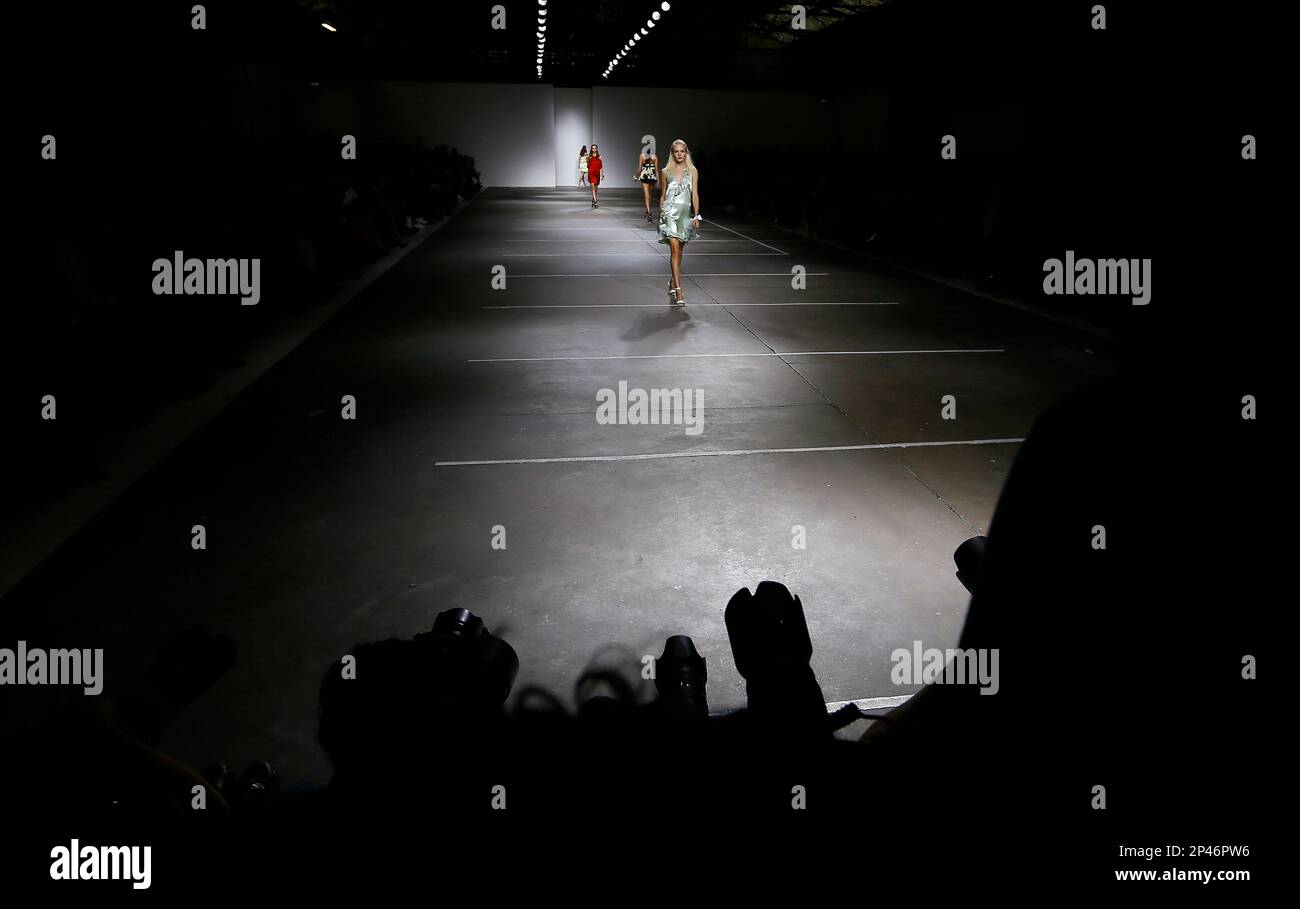 A model wears an outfit by designer Unique during the Spring