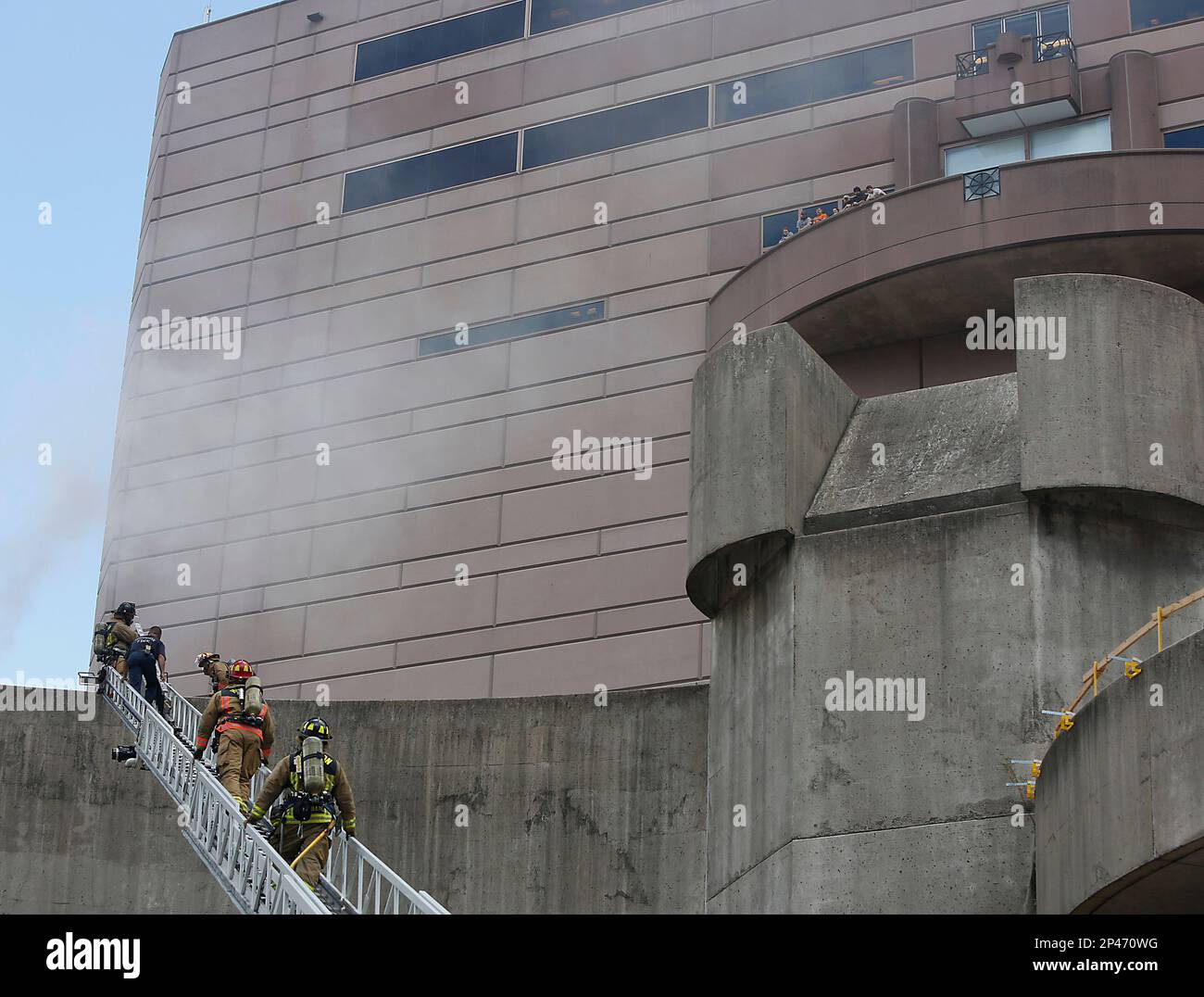 Houston Fire Department firefighters work at the scene of a fire at ...