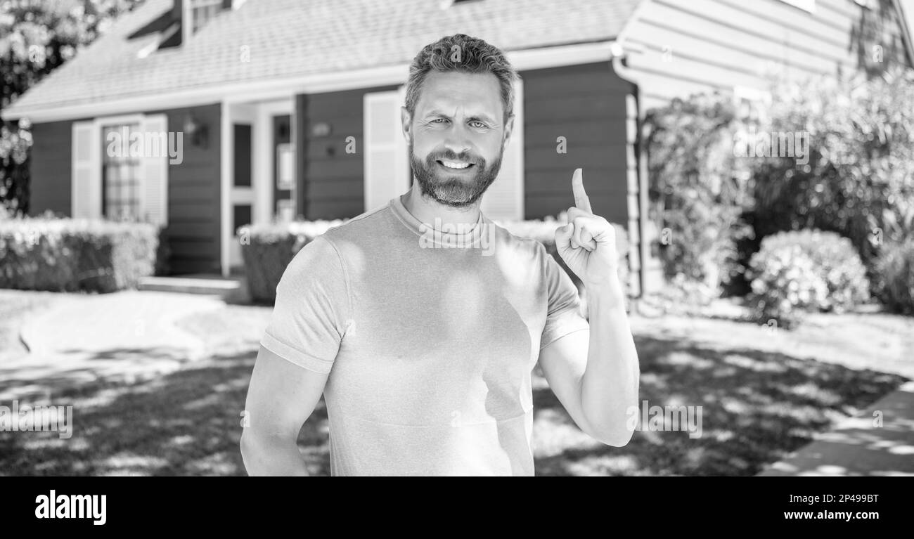 happy bearded man inspired with idea, real estate Stock Photo