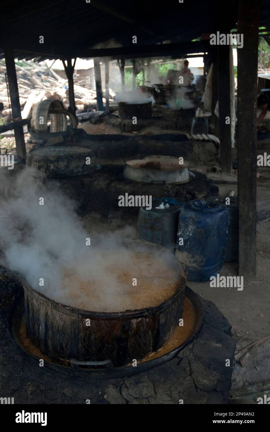 Pot of boiling palm sugar in palm sugar factory, near Sukamade, East Java, Indonesia Stock Photo