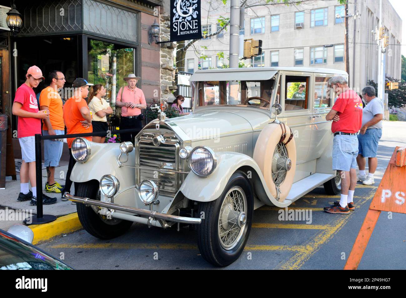 Car enthusiasts look over a 1928 PierceArrow Model 36 Sedan on display