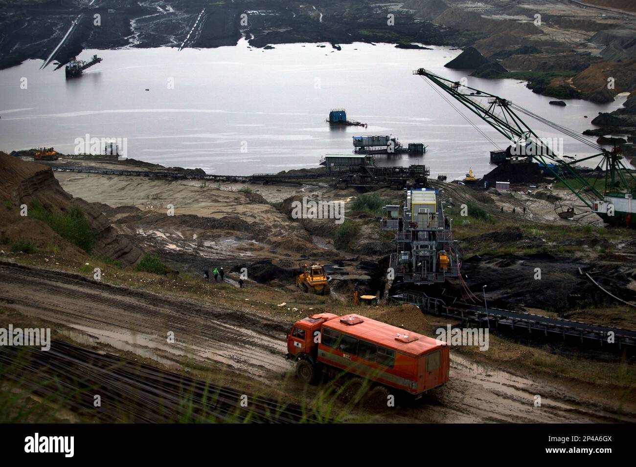 a-truck-passes-by-a-flooded-open-coal-mine-pit-in-kostolac-some-70
