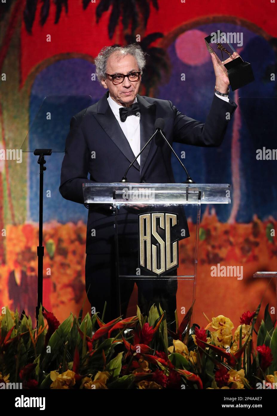 Darius Khondji accepts the 'International Award' onstage during the