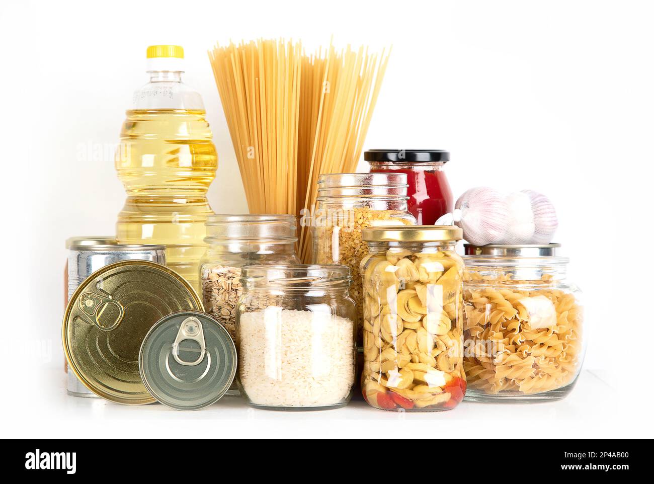 Food supplies. Crisis food stock. Different glass jars with grains, pasta, oil, nut, canned food Stock Photo