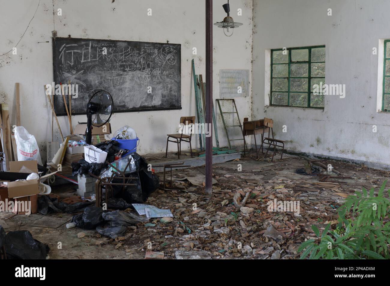 Schoolroom in the long-closed Kai Choi School near Kuk Po, an abandoned village in northeast New Territories, Hong Kong, China Stock Photo