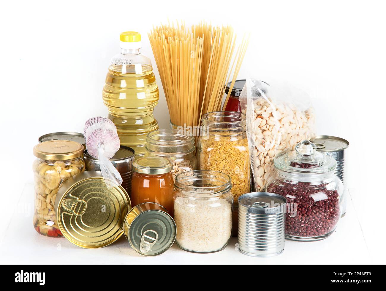 Food supplies. Crisis food stock. Different glass jars with grains, pasta, oil, nut, canned food Stock Photo