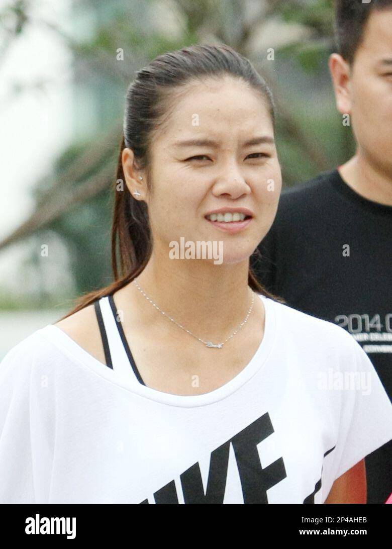 Chinese tennis star Li Na is pictured as she arrives for the unveiling