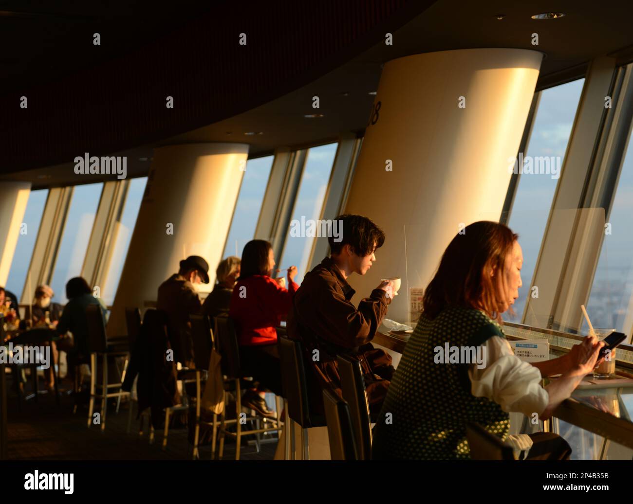 Tourist enjoying the views from the top of the Skytree in Sumida-City, Tokyo, Japan. Stock Photo