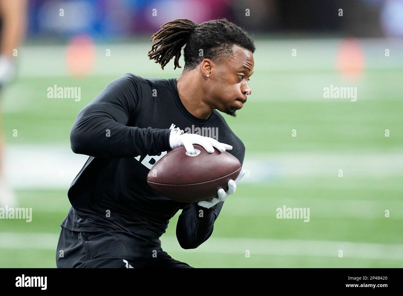 East Carolina running back Keaton Mitchell runs a drill at the NFL