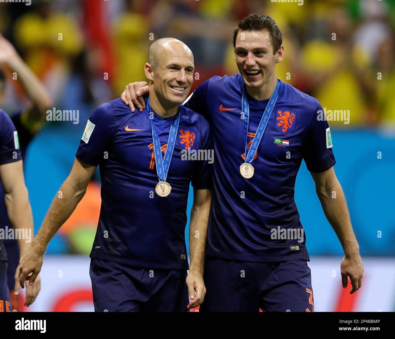 Netherlands' Arjen Robben, left and Stefan de Vrij walk together after medal presentations following their 3-0 victory over Brazil in the World Cup third-place soccer match between Brazil and the Netherlands at the Estadio Nacional in Brasilia, Brazil, Saturday, July 12, 2014. (AP Photo/Natacha Pisarenko) Stock Photo