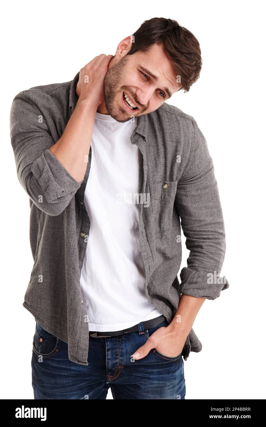 Straining Neck Angry Stress can be a pain in the neck. Studio shot of a young man grimacing ...
