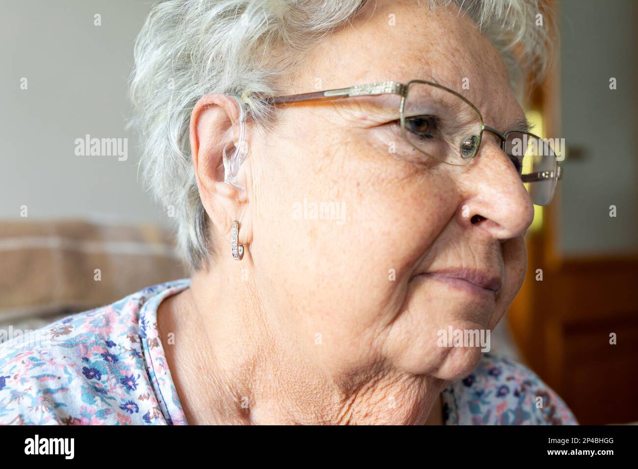 woman wearing digital hearing aid Stock Photo