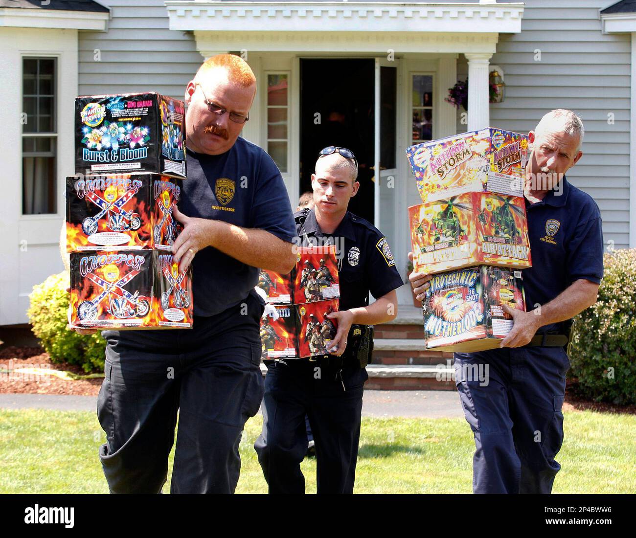 FILE - In this July 4, 2012 file photo, law enforcement officials 