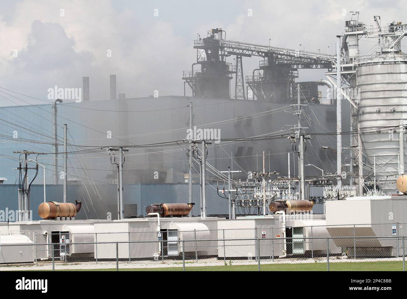 Firefighters and emergency personnel respond to a fire at the