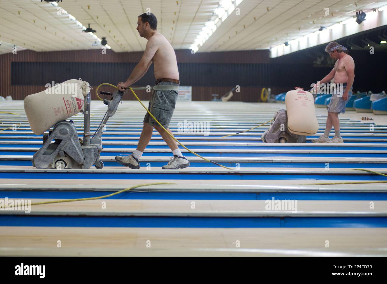 Jeff Guldi, left, and Dave Liebler with Statewide Resurfacing walk a