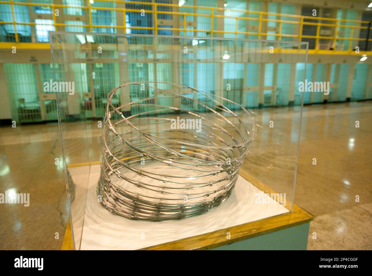 An exhibit containing barbed wire is displayed at the Cell Block 7 ...