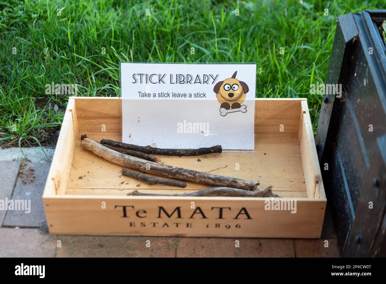 Stick library in Greytown, New Zealand. Humorous stick lending library for dogs. Take a stick