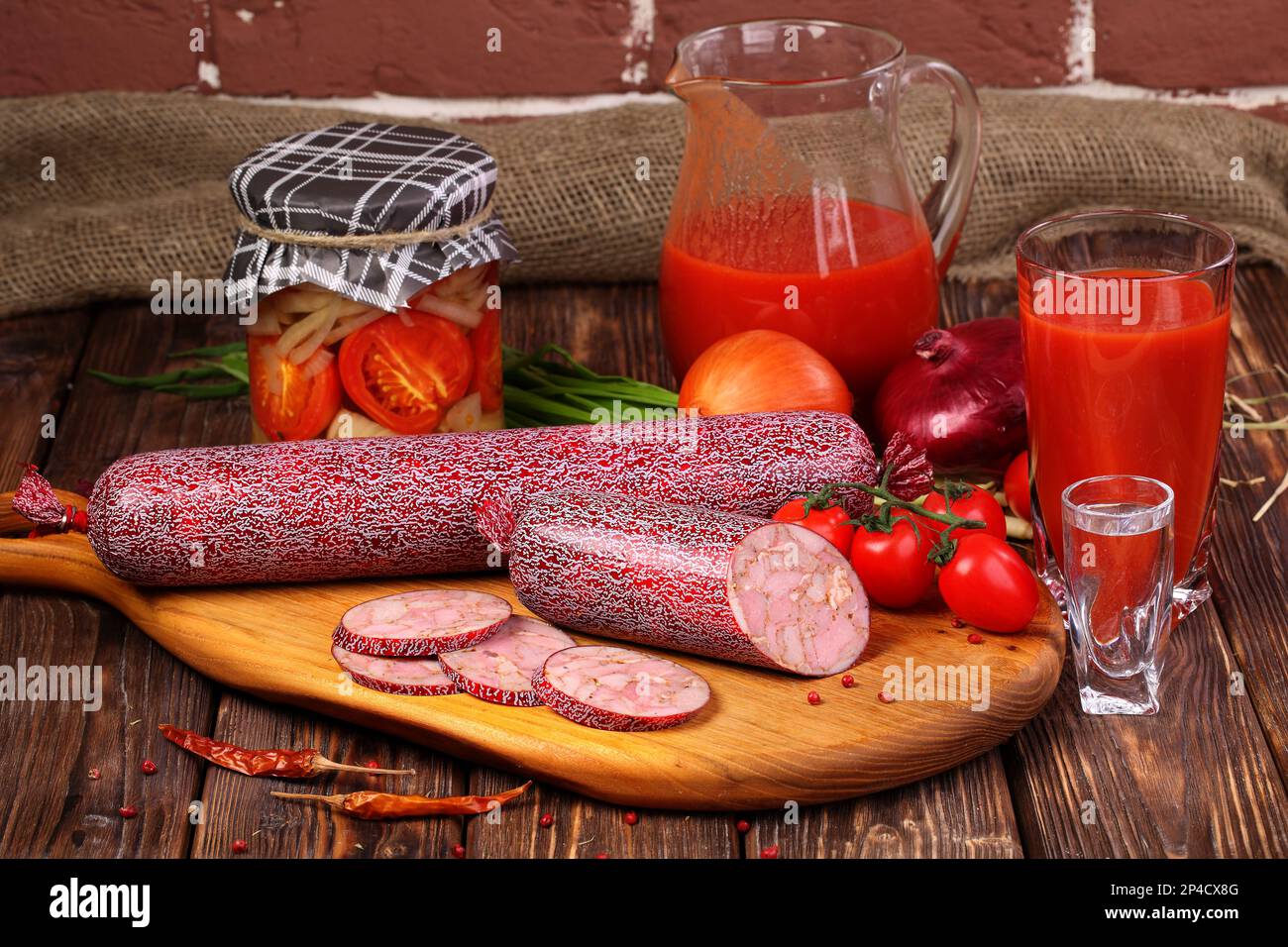 Sausage with tomato juice Stock Photo Alamy