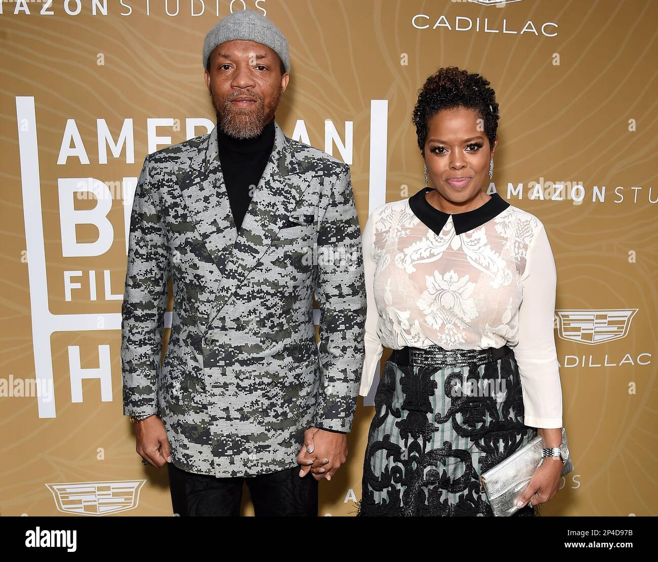 Tariq Walker and Malinda Williams walking the red carpet at the 5th