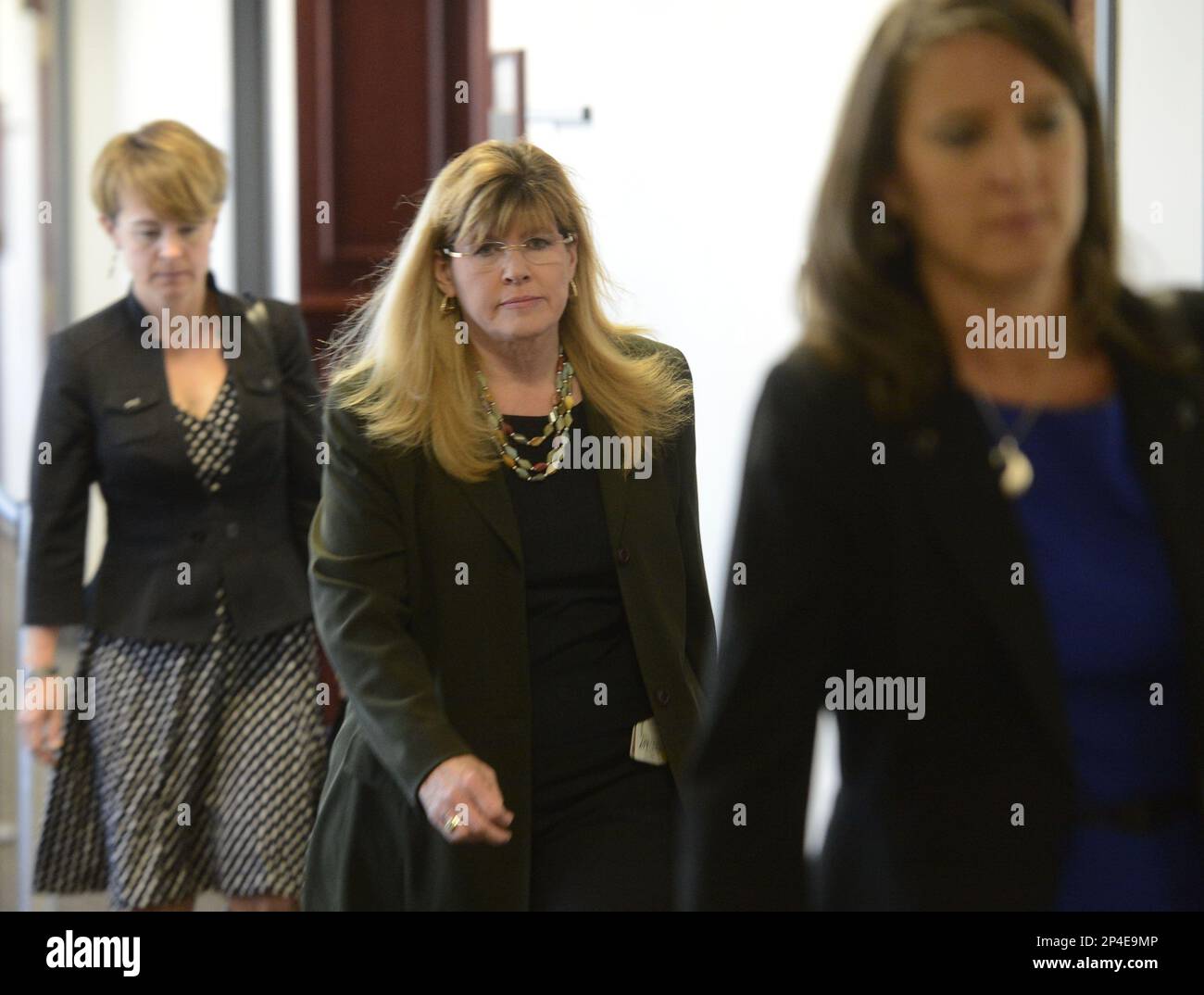 Assistant Arapahoe County district attorney Karen Pearson, center