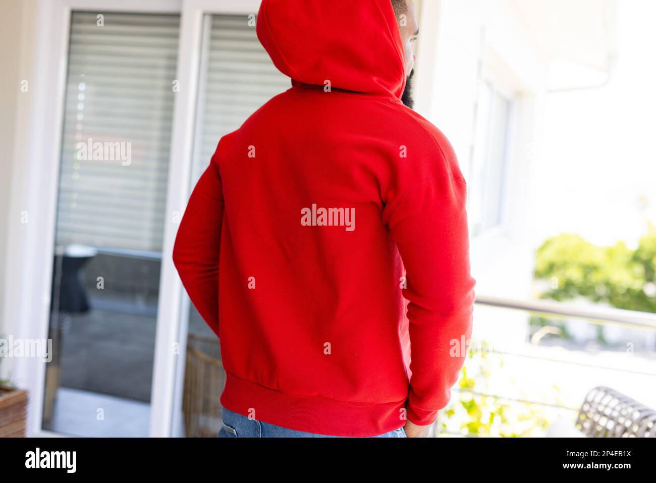 African american man wearing red sweatshirt with copy space. Fashion, design, color and clothes concept. Stock Photo