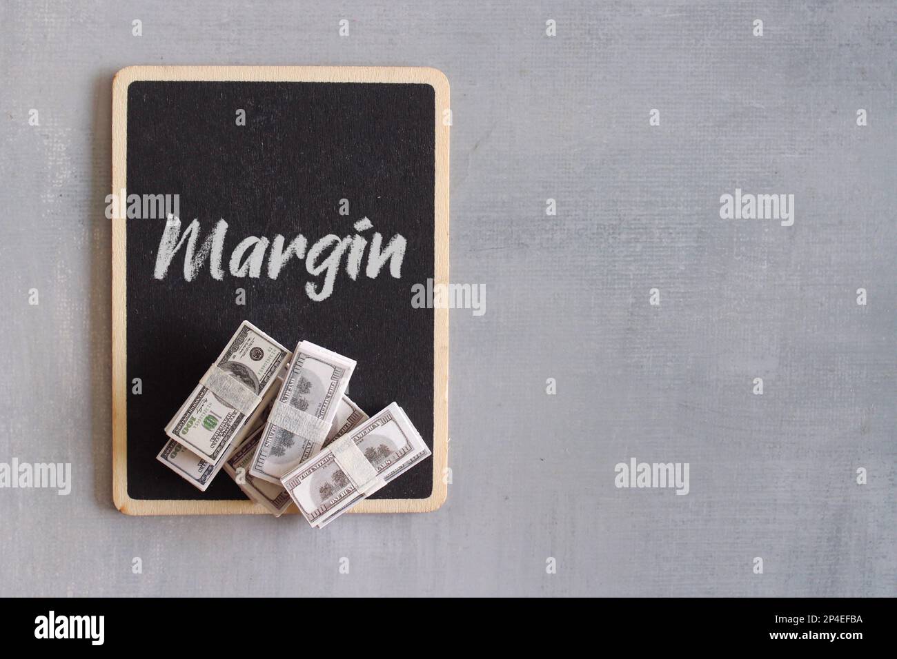 Money and chalkboard with text margin business concept stock photo alamy